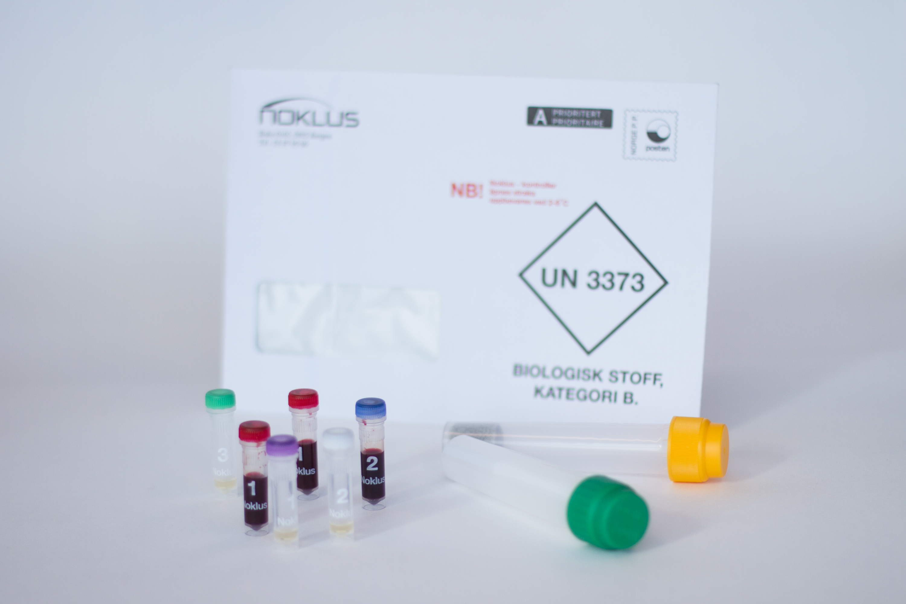 A white box with a group of bottles in it