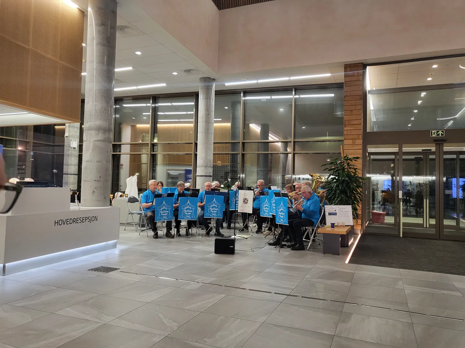 A group of people in blue shirts