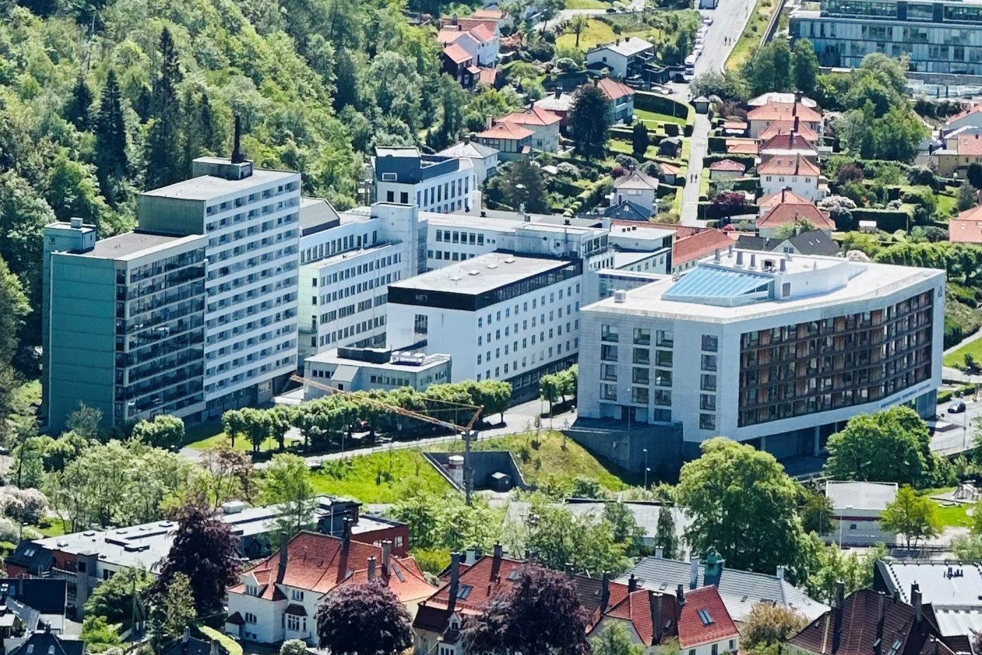 A group of buildings with trees in the front