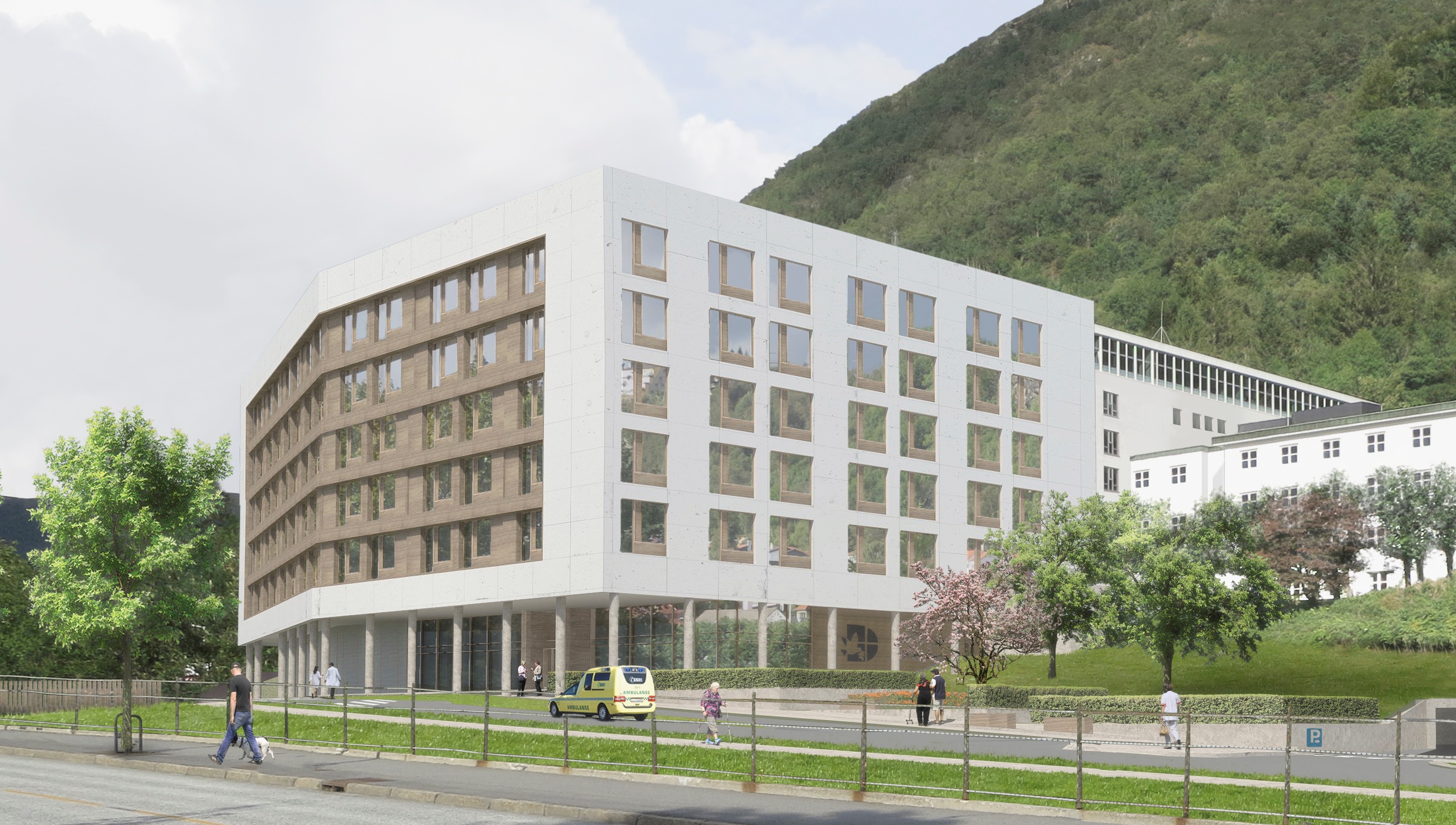 En stor hvit bygning med en høyde i bakgrunnen